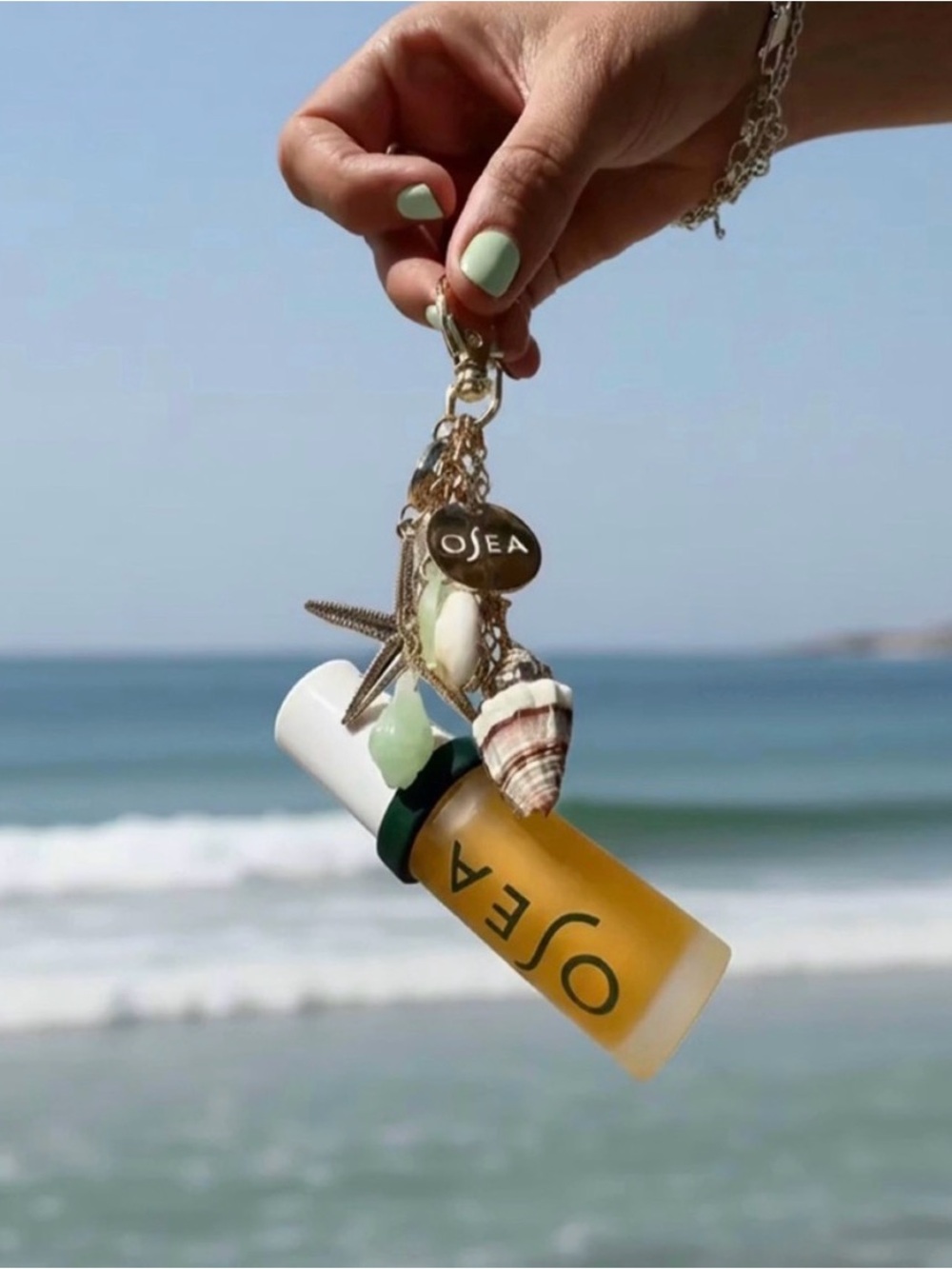 Osea nautical gold charm with lip oil keychain with dust cover bag NEW!